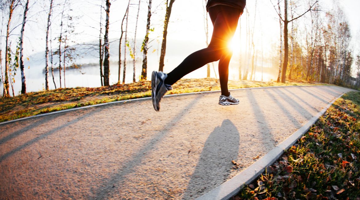 Man run at autumn morning. Healthy new year resolutions training.
