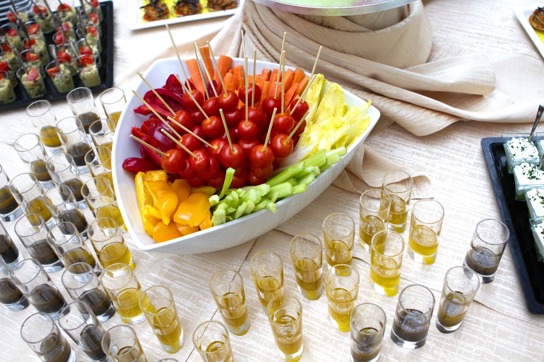 Vegetable crudite with cherry tomatoes, yellow peppers, celery and salad served with olive oil and vinaigrette.